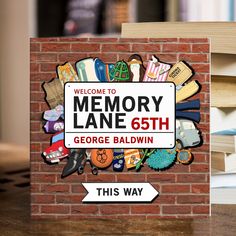 there is a sign that says, welcome to memory lane 65th george baldwin this way