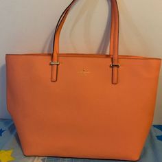 Brand New, Very Cute Bag. The Cedar Street Medium Harmony Tote From Kate Spade New York Features A Clean And Simple Design With A Roomy Interior. This Bag Makes Your Daily Actives Easy And Stylish. 12.5''H X 13.3''W X 6.6''D. Drop Length: 9''. Crosshatched Saffiano Leather With Matching Trim. 14-Karat Light Gold Plated Hardware. Custom Woven Caroleena Spade Dot Lining. Over The Shoulder Bag With Zip Top Closure. Interior Zip And Double Slide Pockets. Color: Guava Style# Pxru4423 Over The Shoulder Bag, Over The Shoulder Bags, Kate Spade Bag, Cute Bag, Zip Top, Kate Spade New York, Womens Tote Bags, Simple Design, Bag Making