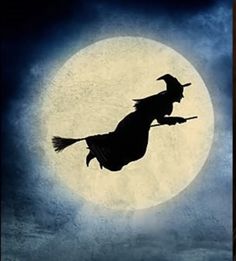 the silhouette of a witch flying in front of a full moon