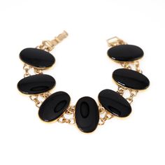 "Discover elegance and charm with our Vintage 1940s Black Onyx Bracelet. This exquisite piece showcases black onyx gemstones set in yellow gold-filled metal, exuding timeless sophistication. Perfect for special occasions or everyday style, it's a must-have for vintage enthusiasts looking to add 1940s flair to their collection. Elevate your look with this classic beauty today! The bracelet is in very good vintage condition with minimal signs of wear. The surface of the gold-fill and onyx shows fi Black Onyx Bracelet, Boulder Co, Onyx Bracelet, Classic Beauty, Chain Link Bracelet, Everyday Style, Black Onyx, Link Bracelets, Chain Link