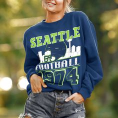 This Vintage, Seattle Football sweatshirt is perfect to root on the Seattle Seahawks this football season! Available in white, sport grey, heather grey, black, or navy. Grab one for your boyfriend/husband/best friend/mom/dad etc to match! Ideal for any situation, a unisex heavy blend crewneck sweatshirt is pure comfort. These garments are made from polyester and cotton. This combination helps designs come out looking fresh and beautiful. The collar is ribbed knit, so it retains its shape even af Team-colored Tops For Sports Events In Fall, Fall Sports Team Logo Tops, Fall Sports Event Tops With Team Logo, Long Sleeve Tops For Sports Events, Fall Sports Fan Tops With Letter Print, Sports Fan Letter Print Tops For Fall, Sports Fan Tops With Letter Print For Fall, Game Day Athletic Heather Crew Neck Sweatshirt, Athletic Heather Crew Neck Top For Game Day