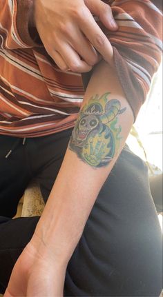 a person with a tattoo on their arm