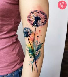 a watercolor tattoo with a dandelion on the left arm and an ink splat