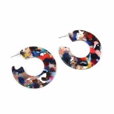 a pair of multicolored hoop earrings on a white background with clippings