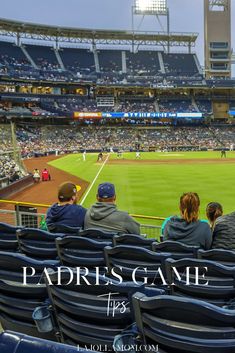 people are sitting in the stands at a baseball game