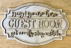 a sign that says, say you're here guest room and stay at home