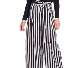 Soft And Light Weight And High Waisted Wide Leg Pant. 100% Polyester Striped Bottoms With Tie Waist For Spring, Chic Full Length Striped Bottoms, Spring Striped Bottoms With Tie Waist, Chic Full Length Striped Pants, Spring Wide-leg Pants With Vertical Stripes, Chic Striped Full-length Pants, Cheap Striped Wide-leg Pants, Chic Striped Full-length Bottoms, Relaxed Fit Vertical Stripes Wide-leg Pants