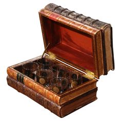 an old wooden box filled with lots of glasses