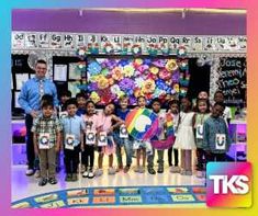 a group of children standing in front of a teacher