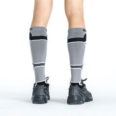 the legs of a person wearing socks and shorts