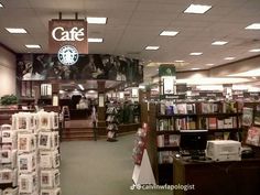 the inside of a starbucks coffee shop with many items for sale in front of it