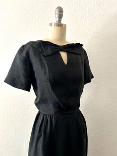 1950s Vintage L'AIGLON Black Silk Cocktail dress Chic Black silk dress with Bow accent Elegant Fit  Metal zipper in back Label:  L'AIGLON - woven especially for  Material:  pure silk 100% Size:  S Bust:  35" Waist:  24" Hips:  36" Length:  39" (back to hem) Condition:  Very good vintage condition 1950s Short Sleeve Dress For Vintage Fashion, 1950s Short Sleeve Vintage Fashion Dress, 1950s Style Short Sleeve Vintage Dress, 1950s Style Vintage Fashion Dress With Short Sleeves, Classic Lined Dresses For Vintage Fashion, 1950s Style Vintage Fashion Dresses, 1950s Style Short Sleeve Vintage Dress For Formal Occasions, 1950s Style Short Sleeve Evening Dresses, Vintage Short Sleeve Evening Dresses