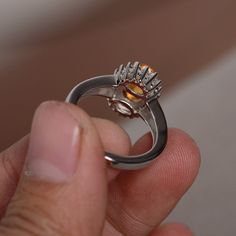 This is a gorgeous handmade creation. Its beauty is its simplicity & Elegance. The 6*8mm oval natural citrine is crafted in solid sterling silver and with rhodium plated. It's made to order and it will take about 7-10 days to make it. All item is sent in a beautiful gift box You can realize more lovely stuff clicking the link https://www.etsy.com/shop/knightjewelry?refshopsection_shophome_leftnav Please leave the correct address and you phone number for delivering successfully. Oval Citrine Ring With Polished Finish, Oval Citrine Silver Ring, Silver Citrine Oval Crystal Ring, Luxury Silver Topaz Ring With Citrine, Oval Citrine Topaz Ring In White Gold, Silver Citrine Topaz Ring With Prong Setting, November Birthstone Ring, Brown Gemstone, Smoky Quartz Ring