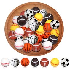 a wooden bowl filled with lots of different types of balls on top of each other