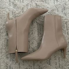 Brand New, Never Been Worn. Plastic Tan Boots With Pointed Heel. Beige Heels For Night Out In Fall, Beige Heels For Fall Night Out, Chic Beige Boots For Night Out, Chic Beige Boots For Workwear, Chic Beige Boots For Work, Fitted Beige Heeled Boots For Work, Chic Beige Workwear Boots, Chic Heeled Boots With Zipper For Spring, Chic Heeled Boots With Zipper Closure For Spring