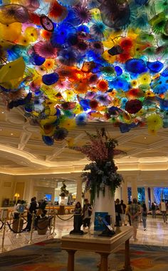 the ceiling is made up of multicolored glass flowers