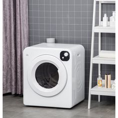 a white washing machine sitting in front of a gray tiled wall next to a ladder