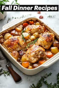 a white casserole dish filled with chicken, potatoes and carrots