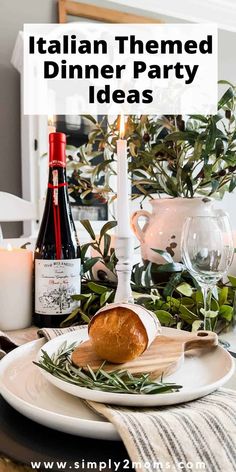 an italian themed dinner party table setting with wine, bread and greenery on it