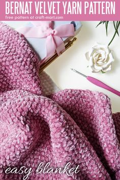 an easy crochet blanket with text overlay that reads, bernat velvet yarn pattern