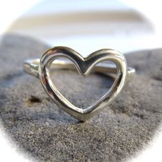 Sterling Silver Heart Ring~ Send a gift of love, let your loved one know they are loved with this sweet heart ring. Custom made for you, each ring is hand forged with sterling silver and hammered and polished to a beautiful shine. Great gift for the sweetheart in your life! *This listing is for 1 sterling silver heart ring made with 14 gauge wire.* Each ring is a one of a kind, hand shaped and hammered and will vary. Also available in 14k gold fill~ https://www.etsy.com/listing/111604268/gold-he Surfer Girl Gifts, Gold Wave Ring, Gold Waves, Silver Heart Ring, Rings For Girls, Thumb Rings, Maui Hawaii, Sterling Silver Bands, Sterling Silver Heart