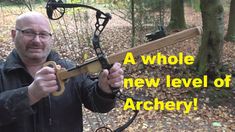 a man holding a bow and arrow in his hands with the words, a whole new level of archery