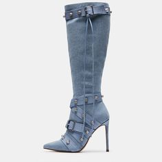 These knee boots feature a striking pointed toe and a stylish stiletto heel that elevates your look with sophistication. The denim material lends a trendy appeal, while the buckle detailing adds a touch of edginess. Adorned with shimmering studs, these boots make a bold fashion statement. Designed with a convenient zipper closure, they ensure easy wearing and removal. Whether you're heading to a night out or a casual outing, these versatile boots effortlessly enhance your style. Step into confid Luxury Blue High-top Boots, Luxury Ankle-high Moto Boots With Reinforced Heel, Blue Grey Tall Womens Boots Von Maur, Luxury Winter Knee-high Boots With Stacked Heel, Luxury High-top Synthetic Boots, Denim Heels, Denim Boots, Super High Heels, Blue Heels