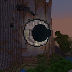 an eyeball is shown in the middle of a large building with trees around it