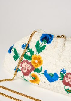 Add some floral flair to your summer wardrobe with the Vela Crochet Clutch. Perfect for beach days or nights out, this clutch features delicate embroidery and crochet details for a playful touch. Its optional gold chain allows for versatile styling options and the cotton stripe lining adds a pop of color. Don't miss out on this fun and functional accessory! Delicate Embroidery, Crochet Clutch, Functional Accessories, Crochet Details, Beach Days, Summer Wardrobe, Beach Day, Gold Chain, Gold Chains