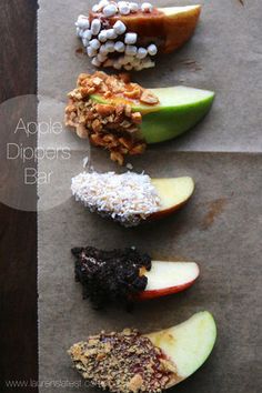 apples, raisins, and apple dippers are arranged on top of each other