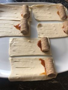 some food is laying out on a white plate and ready to be cut into pieces