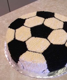 a black and white cake sitting on top of a table