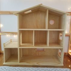 a doll house made out of plywood and wood