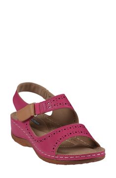 Breathable perforations and an adjustable ankle strap add modern elements to a cushioned sandal set on a modest platform and durable rubber sole. 1/2" platform Adjustable ankle strap with hook-and-loop closure Memory foam cushioning with arch support Synthetic upper and lining/rubber sole Imported Pink Closed Toe Sandals With Arch Support, Red Sandals With Adjustable Strap And Round Toe, Pink Open Toe Sport Sandals With Arch Support, Pink Low Heels, Kate Spade Sunglasses, The Foster, Low Heel Sandals, Designer Crossbody Bags, Sandals Brands