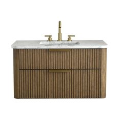 an image of a bathroom vanity with marble top and brass faucet handles on it