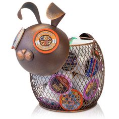 a teapot shaped like a bee with lots of buttons in it