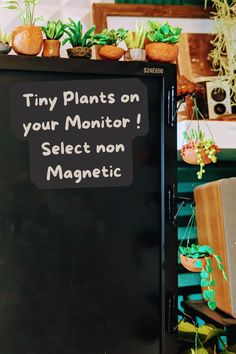 a sign that says tiny plants on your monitor select non magnetic