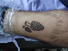 a man's arm with a turtle tattoo on it