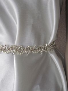 Express Shipping Pearl Crystal rhinestones wedding dress belt pearl belt This is a bridal Sash which you can use in y our most important day. ThisBelt finish with the ribbon. It is 60cm long but i am offen to make custom order, just contact me and let me know which size do you need. The stones are so shiny like the happy briedes. The product is made in smokefree and hygienic place. It wil bel packaged very carefully. I send it via local post service. If you want express delivery please contact m Rhinestone Wedding Dress, Wedding Anklets, Pearl Belt, Wedding Belt, Wedding Dress Belt, Wedding Sash Belt, Wedding Accessory, Wedding Sash, Bridal Sash