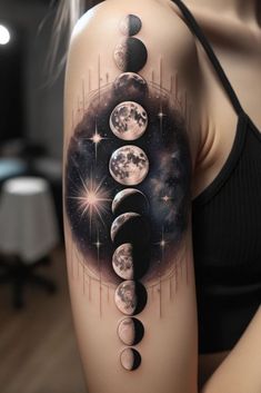 a woman's arm with phases of the moon and stars on her left shoulder