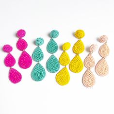 Beautiful hand beaded Stacked Teardrop Fashion Earrings that are perfect for so many fun celebrations, events & occasions. Add a fun pop of color with these fun stacked teardrop shaped earrings. Wear them with everything from jeans to dresses! You will love the colors choices and the attention to detail. Wear them for pool parties, tropical vacations, or just for fun!  ~ See all photos for length   ~ Post back   ~ Price is for 1 pair   ~ Soft felt backing Sign up for New Arrivals & Exclusive Off Statement Beaded Earrings, Tropical Vacations, Earrings Colorful, Teardrop Dangle Earrings, Bead Embroidery Jewelry, Pool Parties, Party Earrings, Handmade Jewelry Designs, Embroidery Jewelry