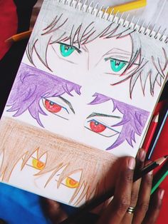 a drawing of two anime eyes with colored pencils