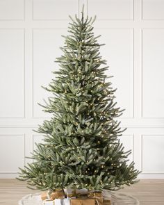 a small christmas tree sitting on top of a table