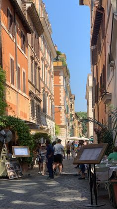 people walking down an alley way in the city