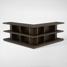 three wooden shelves sitting on top of each other