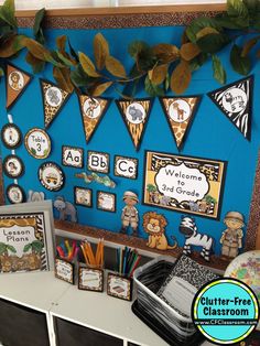 classroom decor with blue walls and lots of pictures on the wall, including bear themed decorations