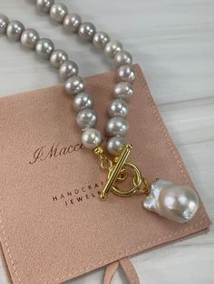 Beautiful Light Gray freshwater Pearl gold necklace with large white baroque lustrous pendant! Wear alone as a statement piece or make it your own by layering, pls see last two images for wearing/layering ideas. The pearl strand is 17 inches, 18 inches with the gold filled toggle lock. It is made with genuine light gray freshwater potato pearls, measures, 9mm to 10mm, carefully knotted. The baroque pearl pendant is large, genuine cultured pearl, has silvery undertone, lustrous, AAA quality pearl Gray Pearl Necklace, Baroque Pearl Pendant, Baroque Pearls Jewelry, Large Pearl Necklace, Grey Pearl Necklace, Pearl Jewelry Design, Baroque Pearl Necklace, Gold Pearl Necklace, Freshwater Pearl Necklaces