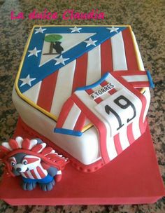 a cake that is shaped like an american flag and has a soccer jersey on it