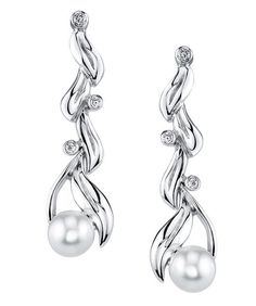 The Flora Earrings are 14kt white gold and feature akoya pearls and 6 diamonds, totaling 0.12ctw. Evening Sterling Silver Pearl Earrings With Diamond Accents, Silver Akoya Pearl Diamond Earrings For Formal Occasions, Formal Silver Diamond Earrings With Akoya Pearl, Fine Jewelry Silver Akoya Pearl Earrings, White Gold Diamond Earrings With Pearl Drop, White Gold Pearl Earrings With Diamond Dangle, White Gold Earrings With Diamond Accents And Pearl, White Gold Diamond Bridal Earrings With Pearl Drop, Silver Diamond Earrings With Pearl Drop