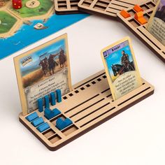 a game board with wooden pieces and cards on it